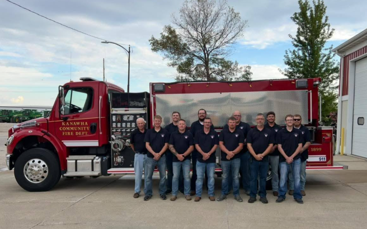 Fire Fighters standing next to fire truck